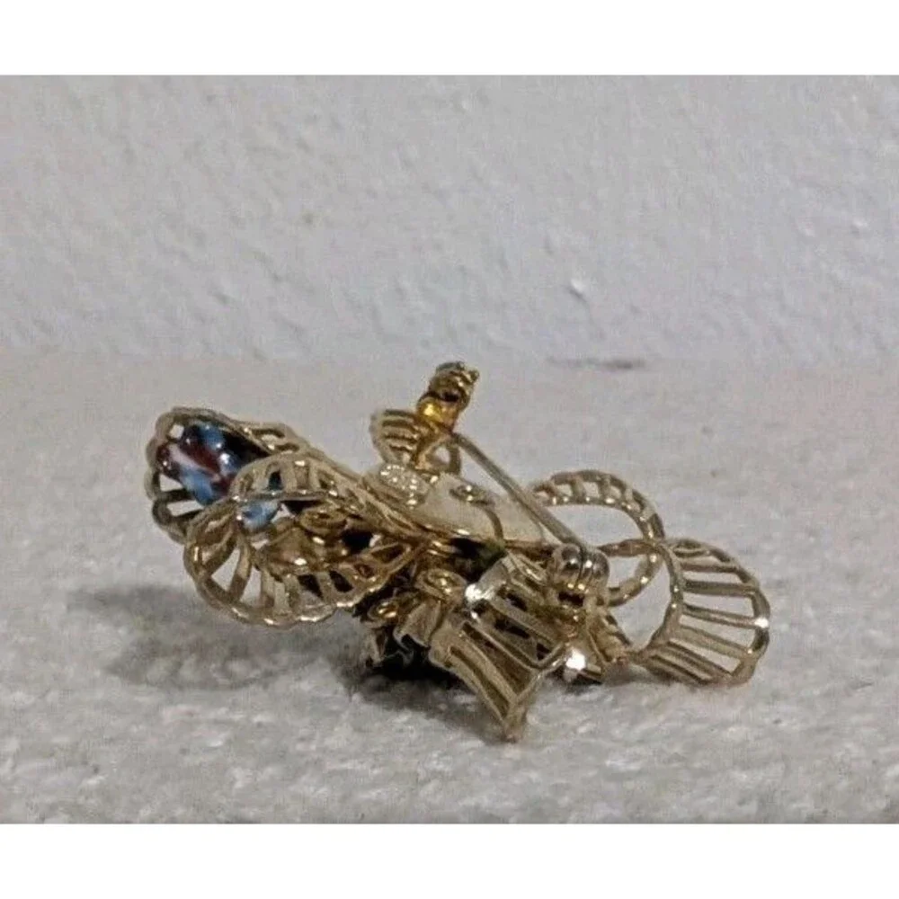 Purple Rhinestone Gold Tone Floral Brooch Signed KRAMER OF NEW YORK Vintage Pin
